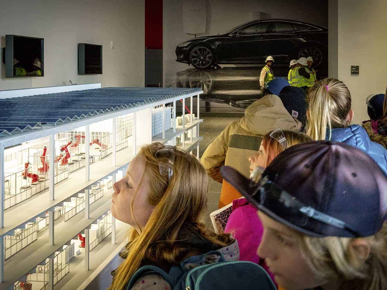 students viewing a model building