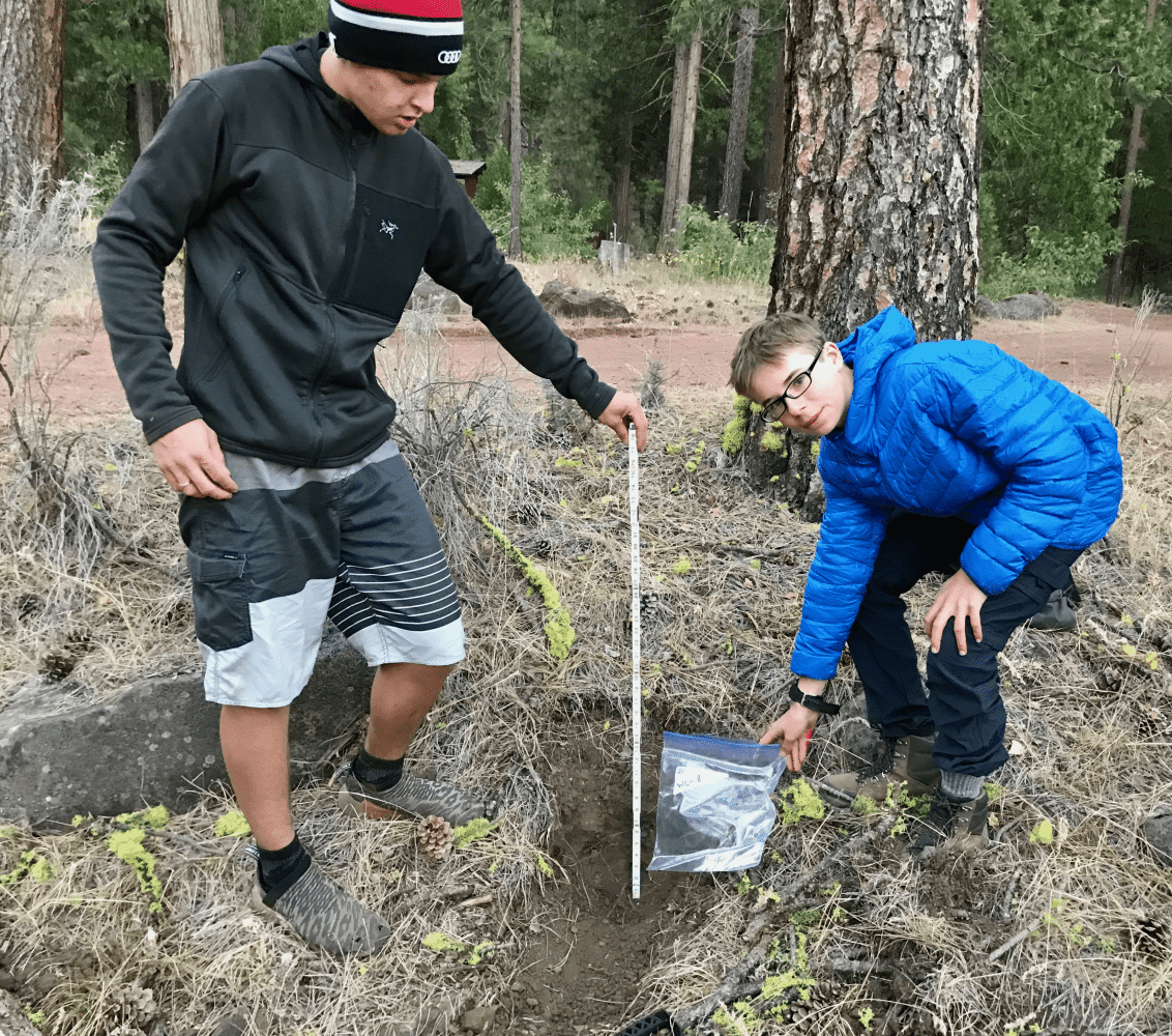 students taking a soil sample
