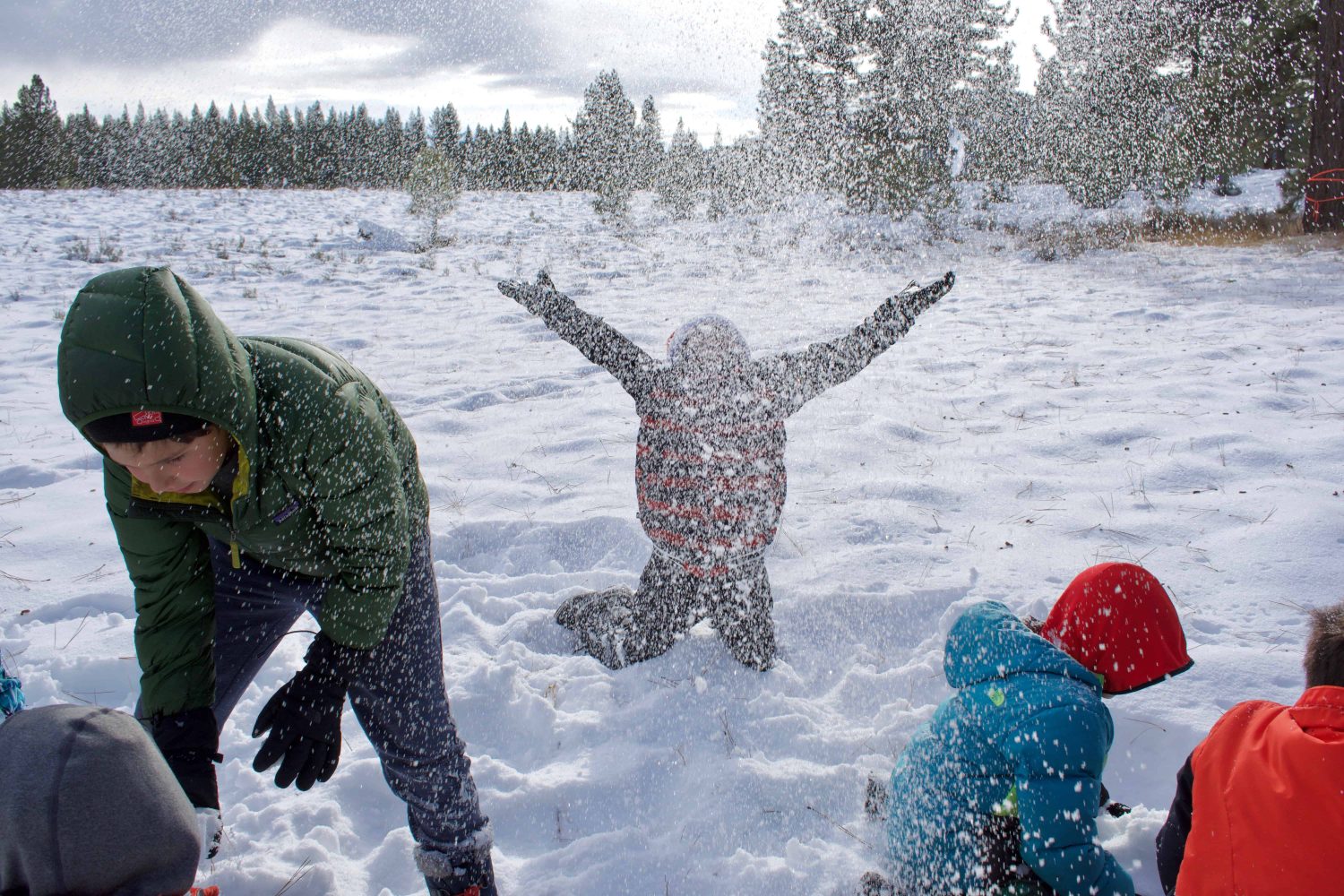 elementary students playing in snow