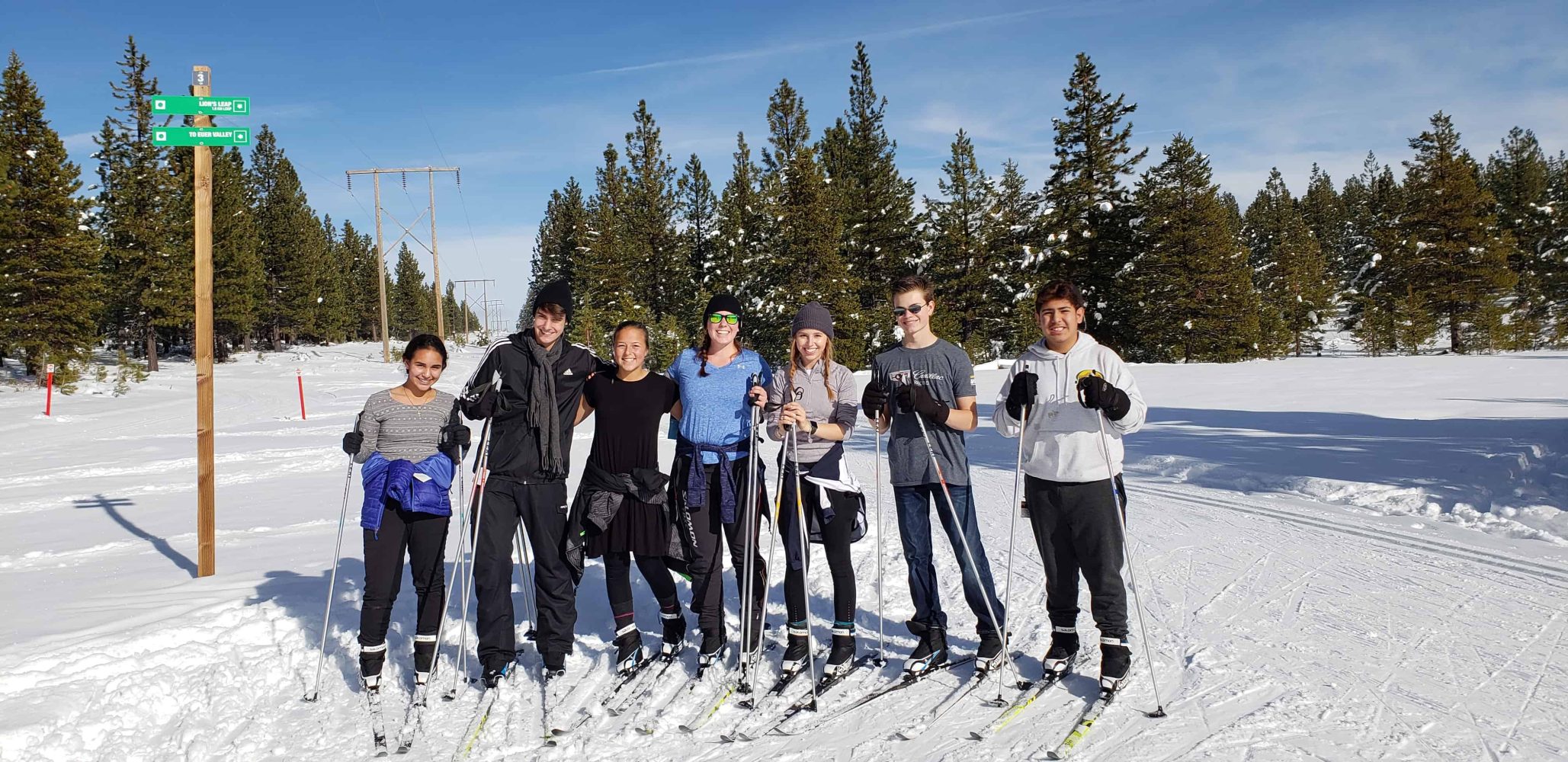 students on skis get their picture taken