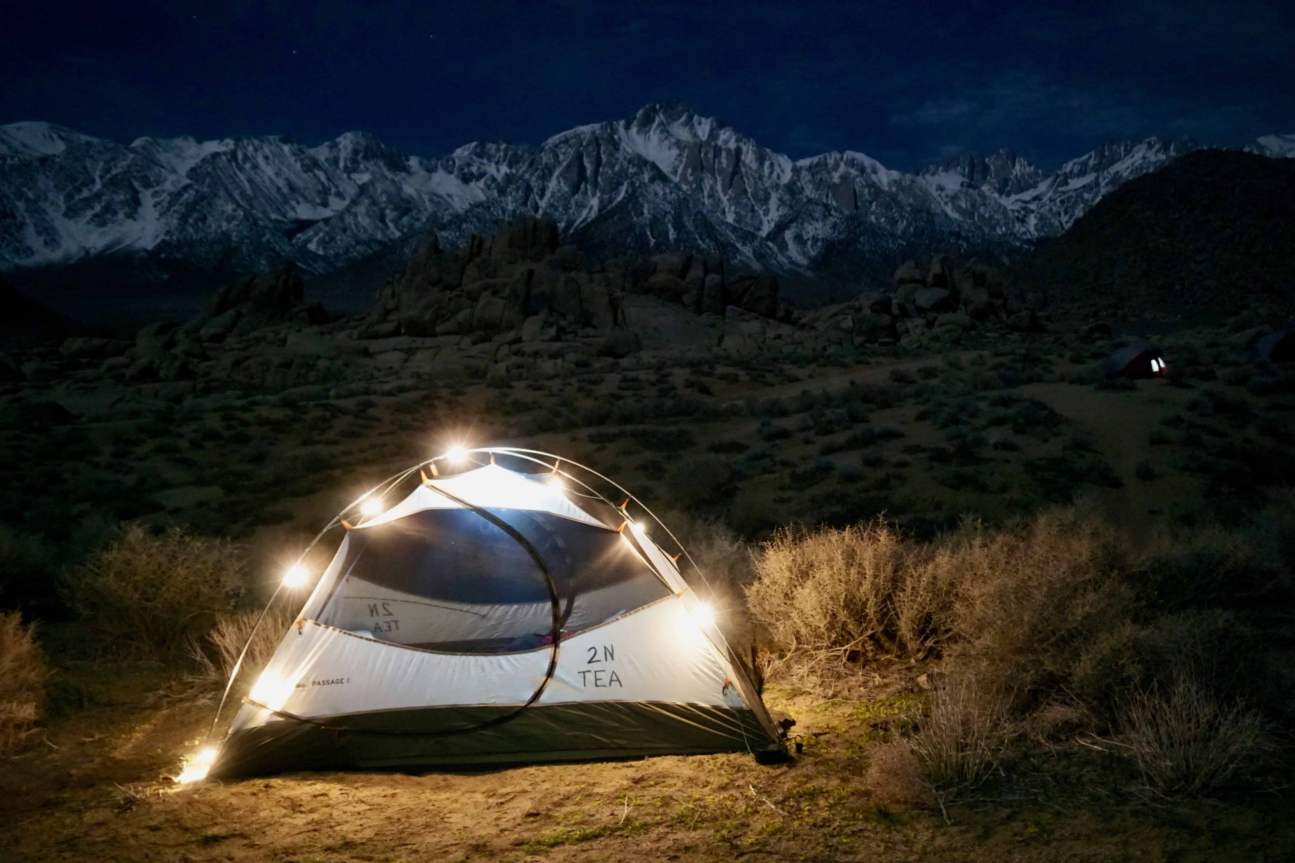 a lit up tent at night